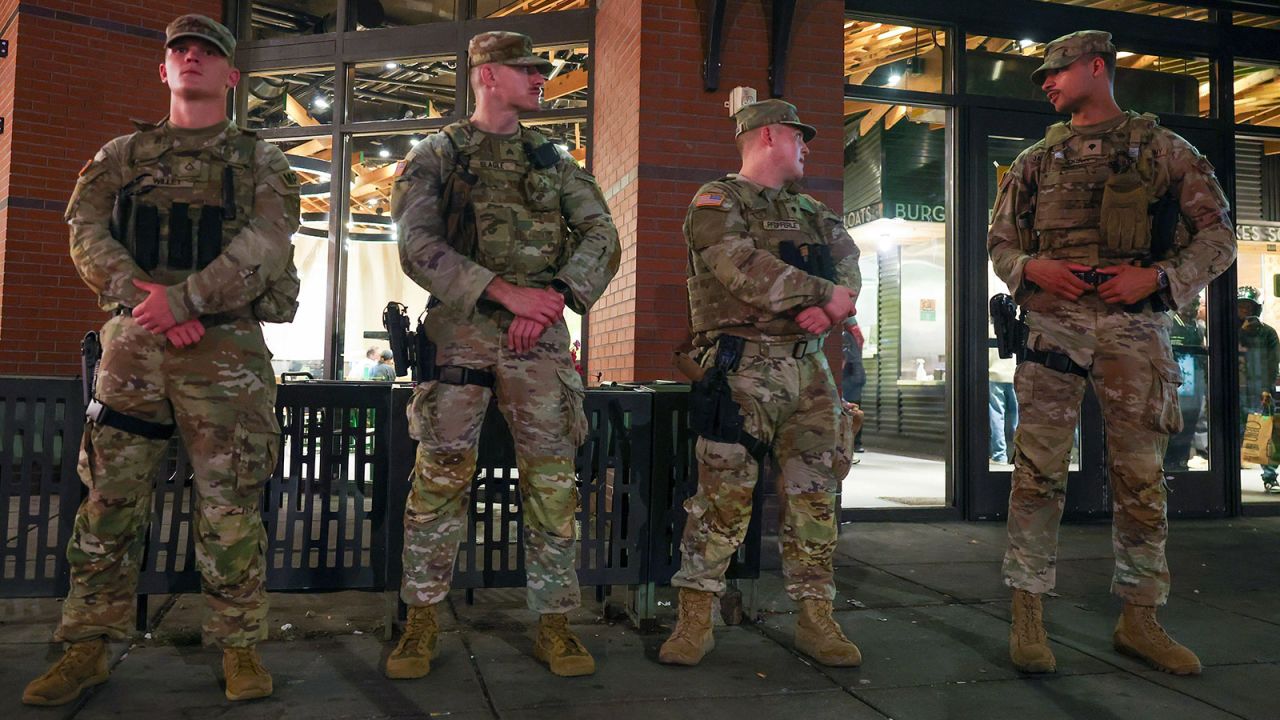 National Guard Members patrol 14th street, working with Washington DC Metro police on August 24, 2025 in Washington, DC. An increased presence of law enforcement has been seen throughout the nation's capital since U.S. President Donald Trump ordered in federal officers and the U.S. National Guard.