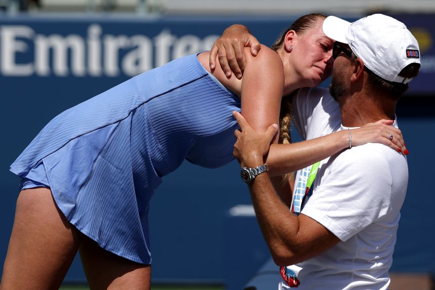 Kvitova embraces her husband and coach Jiří Vaněk after her final match.