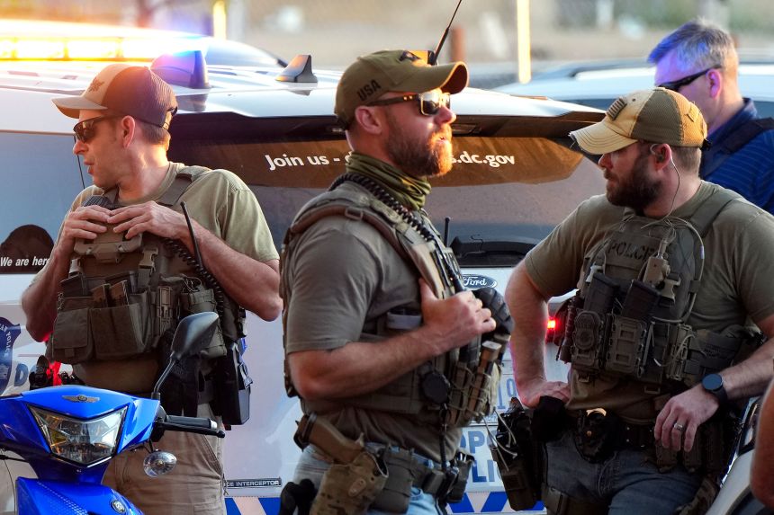 Homeland Security Investigations officers work alongside officers with the Metropolitan Police Department at a checkpoint on North Capitol Street in Washington, DC, on August 25, 2025.