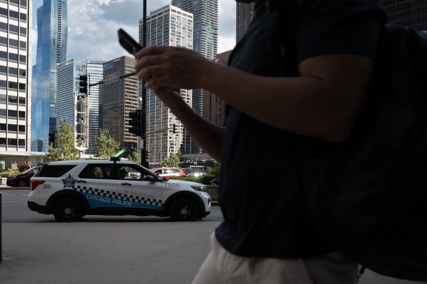 Chicago police patrol the city's downtown on August 26.