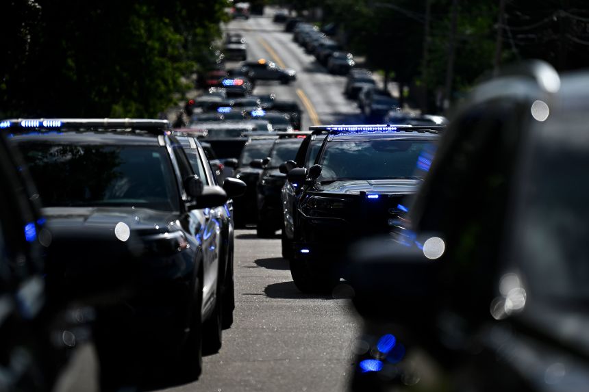 Law enforcement vehicles are parked outside Annunciation Catholic School in Minneapolis following a mass shooting on Wednesday.