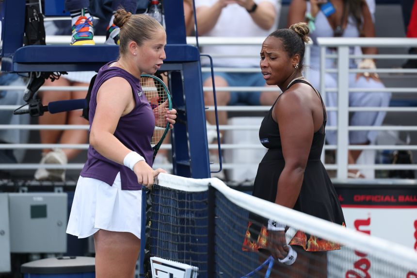 Taylor Townsend (right) and Jelena Ostapenko (left) exchange words after their second round match at the US Open.