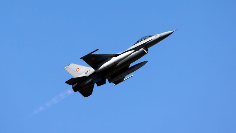 A Romanian Air Force military pilot performs on an F-16 Fighting Falcon jet during the Bucharest International Air Show 2025 BIAS in Romania on August 30.