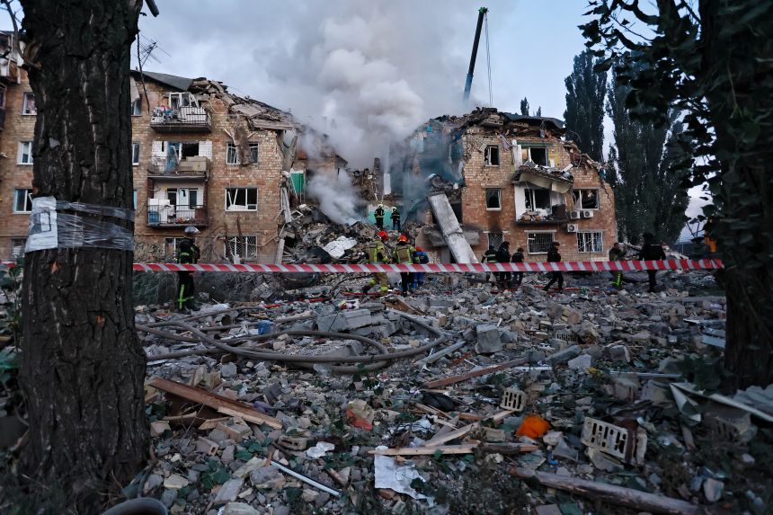 Firefighters extinguish a burning residential apartment building after a Russian drone and missile attack on August 28 in Kyiv, Ukraine.
