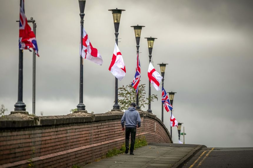 The flag of St George and Union Jack flags hang from lamp posts on Westminster Bridge on in Ellesmere Port on Thursday.