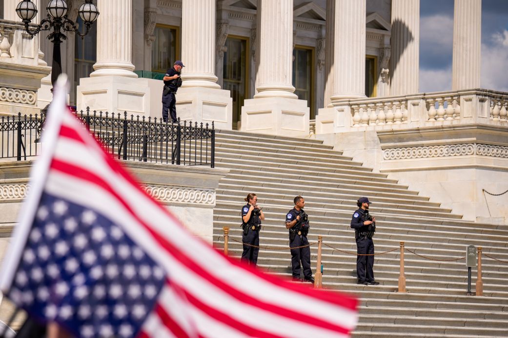 US Capitol police officers stand on guard as a group of protesters march on Capitol Hill in Washington, DC, on September 2, 2025.