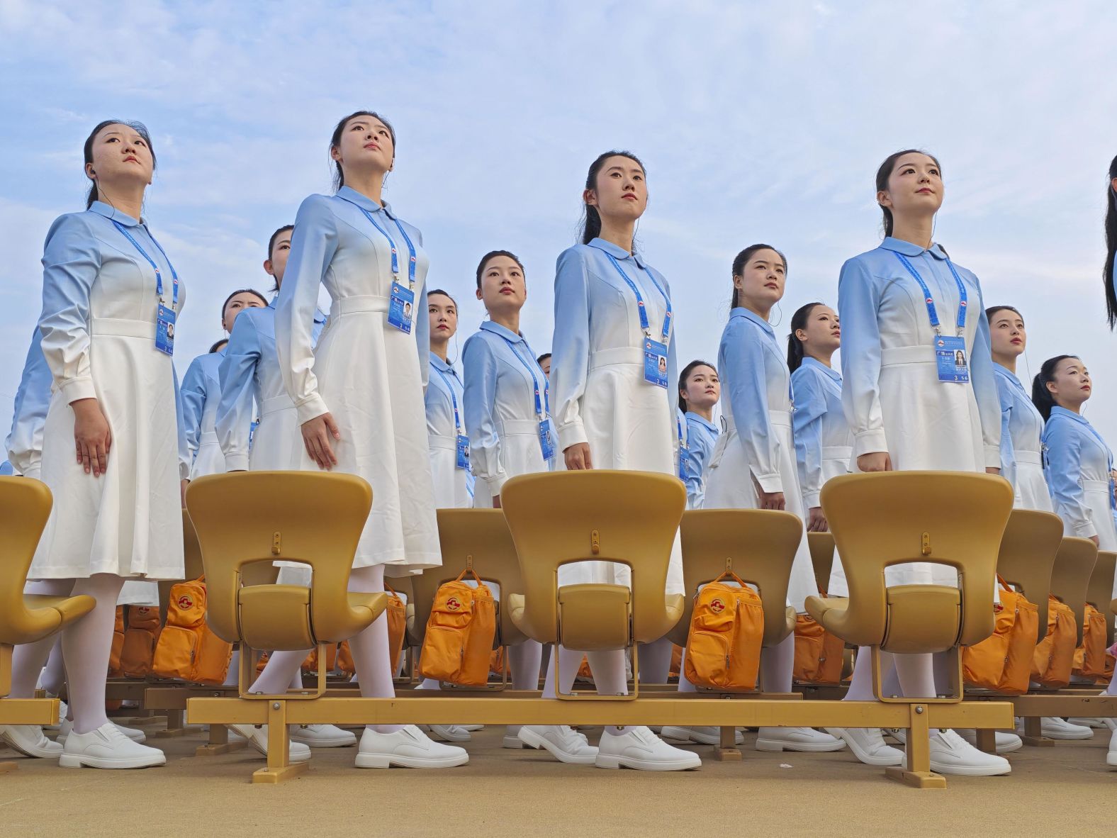 Chorus members line up at Tiananmen Square before taking part in the parade.