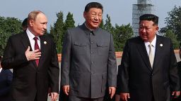 In this pool photograph distributed by the Russian state agency Sputnik, (L-R) Russia's President Vladimir Putin walks with China's President Xi Jinping and North Korea's leader Kim Jong Un before a military parade marking the 80th anniversary of victory over Japan and the end of World War II, in Beijing's Tiananmen Square on September 3, 2025.