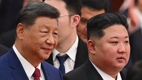 Chinese leader Xi Jinping (L) and North Korean leader Kim Jong Un arrive for a reception in the Great Hall of People, following a military parade marking the 80th anniversary of victory over Japan and the end of World War II, in Beijing on September 3, 2025.
