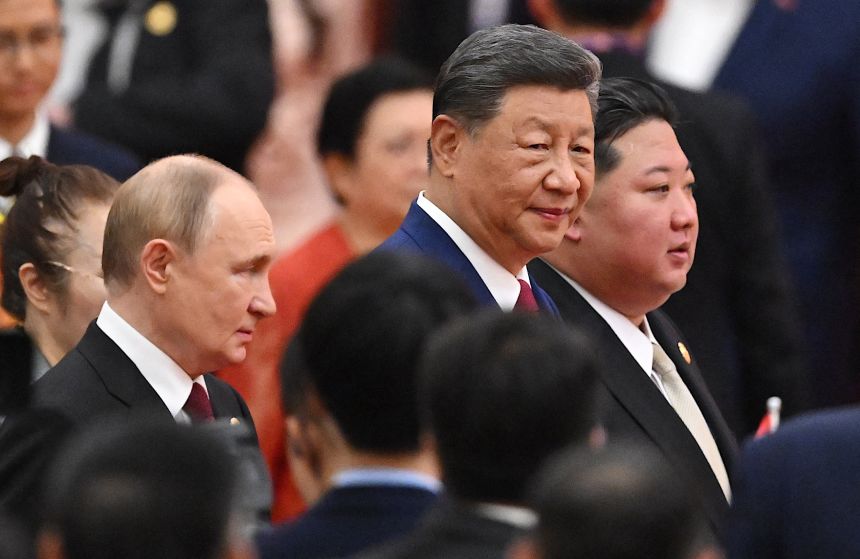 From left, Russian President Vladimir Putin, Chinese leader Xi Jinping and North Korean leader Kim Jong Un arrive for a reception in Beijing on September 3.