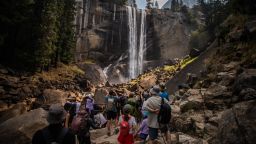Visitors hike the Mist Trail toward Vernal Falls on August 31, 2025 in the Yosemite National Park, California. Due the high volume of visitors during Labor Day weekend, Yosemite required reservations for in-park lodging or camping, and wilderness or Half Dome permits.