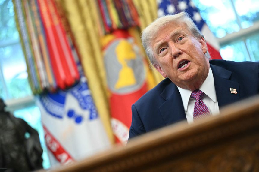 President Donald Trump speaks to reporters in the Oval Office of the White House on Friday.