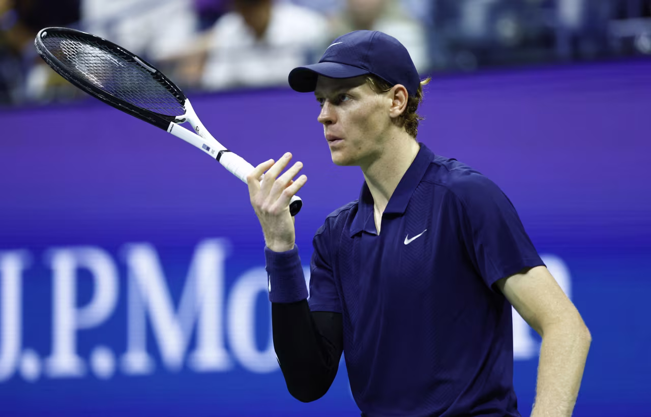 Jannik Sinner blows on his fingers during Friday's match.