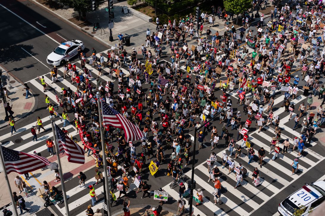 Demonstrators march through formerly named 