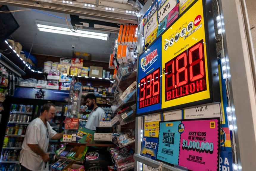 A newsstand in Manhattan advertises the latest Powerball Jackpot of $1.8 billion on Friday.