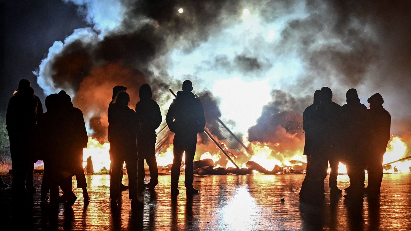 Protesters light a fire during a demonstration in Caen, northwestern France, on Wednesday.