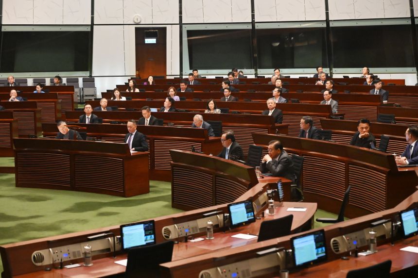 Lawmakers vote in the Legislative Council Chamber.