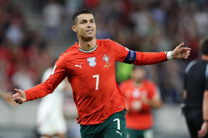 Cristiano Ronaldo celebrates after scoring a goal during a World Cup Qualifying game against Hungary.