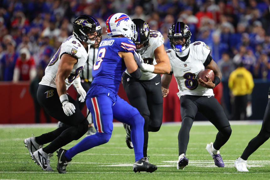 Lamar Jackson of the Baltimore Ravens runs the ball against the Buffalo Bills during the first quarter at Highmark Stadium on September 7 in Orchard Park, New York.