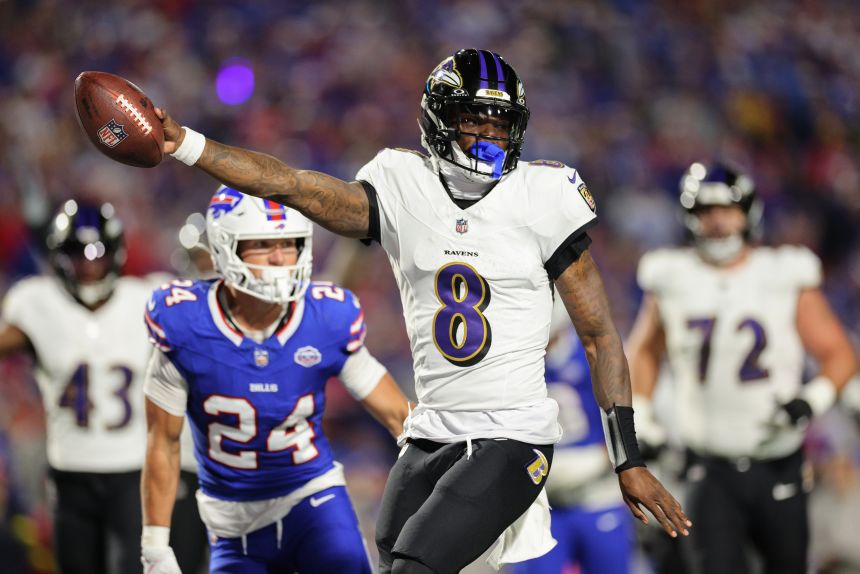 Lamar Jackson #8 of the Baltimore Ravens runs the ball for a touchdown during the second quarter against the Buffalo Bills at Highmark Stadium on September 7.