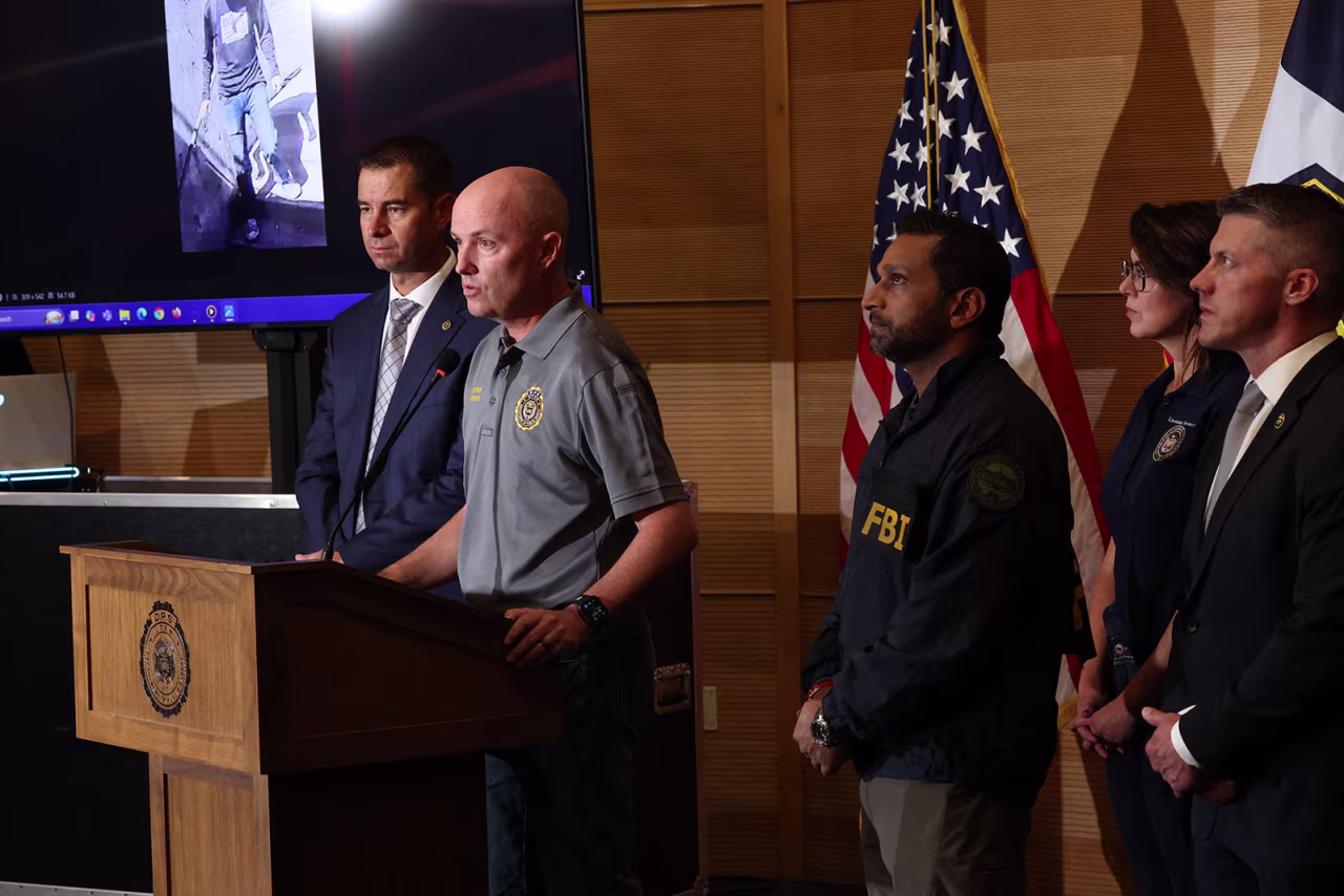 Utah Department of Public Safety Beau Mason, Utah Governor Spencer Cox and FBI Director Kash Patel attend a press conference at Utah Valley University in Orem, Utah, on Thursday.