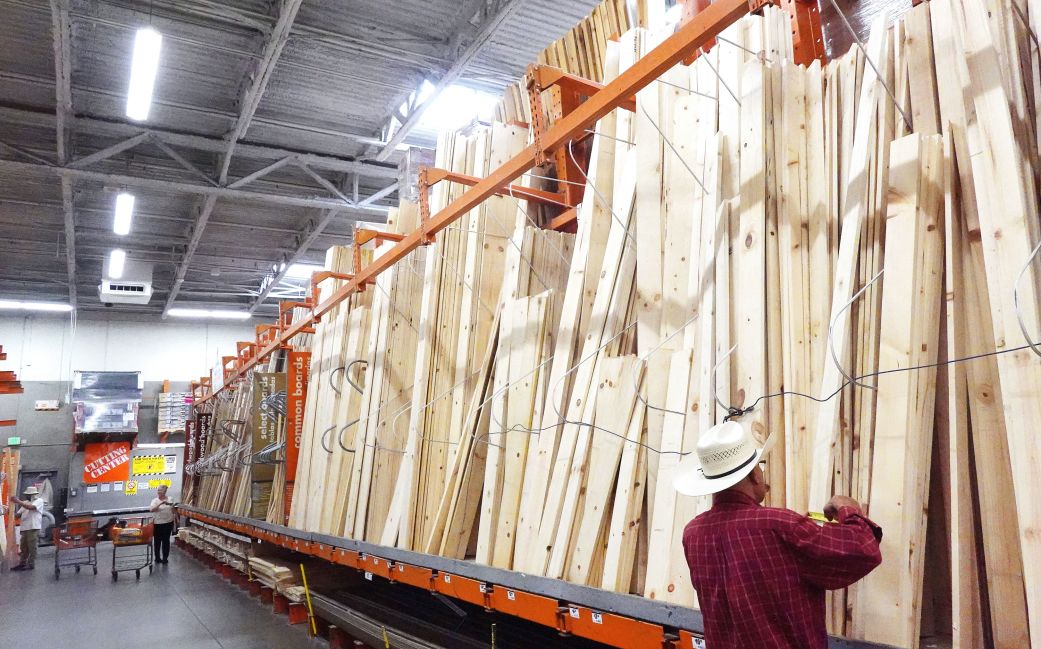 A customer shops in the lumber section of a Home Depot store in Los Angeles, on September 8.