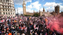 Protesters wave Union Jack and St George's England flags during the "Unite The Kingdom" rally by the Houses of Parliament on September 13, 2025 in London, England. Far-right activist Tommy Robinson (also known as Stephen Yaxley-Lennon) has invited supporters to hold a rally in central London entitled "Unite The Kingdom". The former English Defence League leader and his supporters are actively Islamophobic and racist and have been behind much of the unrest seen outside hotels housing migrants this summer. Stand Up To Racism are mounting a counter-protest to today's rally.