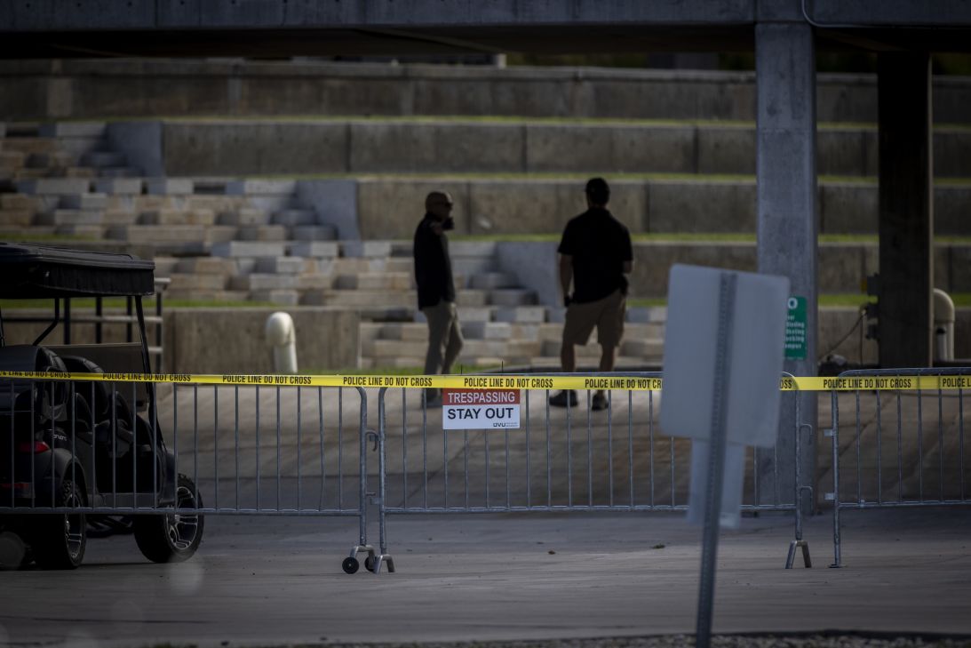 People monitor the crime scene at Utah Valley University in Orem on September 13, following the fatal shooting of Charlie Kirk.