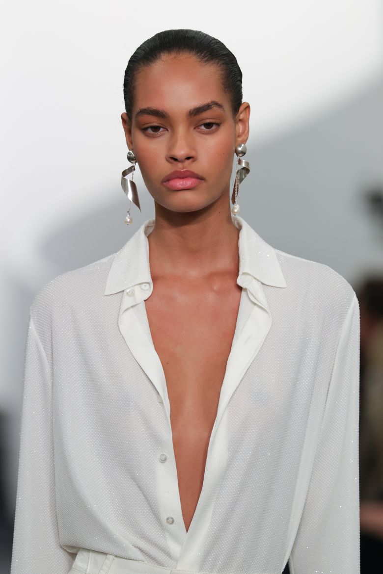 A breezy blouse and statement earrings on the Ralph Lauren runway.