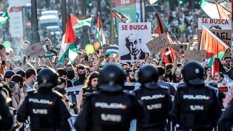 Pro-Palestinians protestors hold a banner reading '(Israel's Prime Minister Netanyahu) wanted' after invading the street during the 21st and last stage of the Vuelta a Espana 2025, in Madrid on September 14, 2025. Vuelta final stage has been abandoned because of pro-Palestinian protests, AFP reports. (Photo by Oscar DEL POZO / AFP) (Photo by OSCAR DEL POZO/AFP via Getty Images)