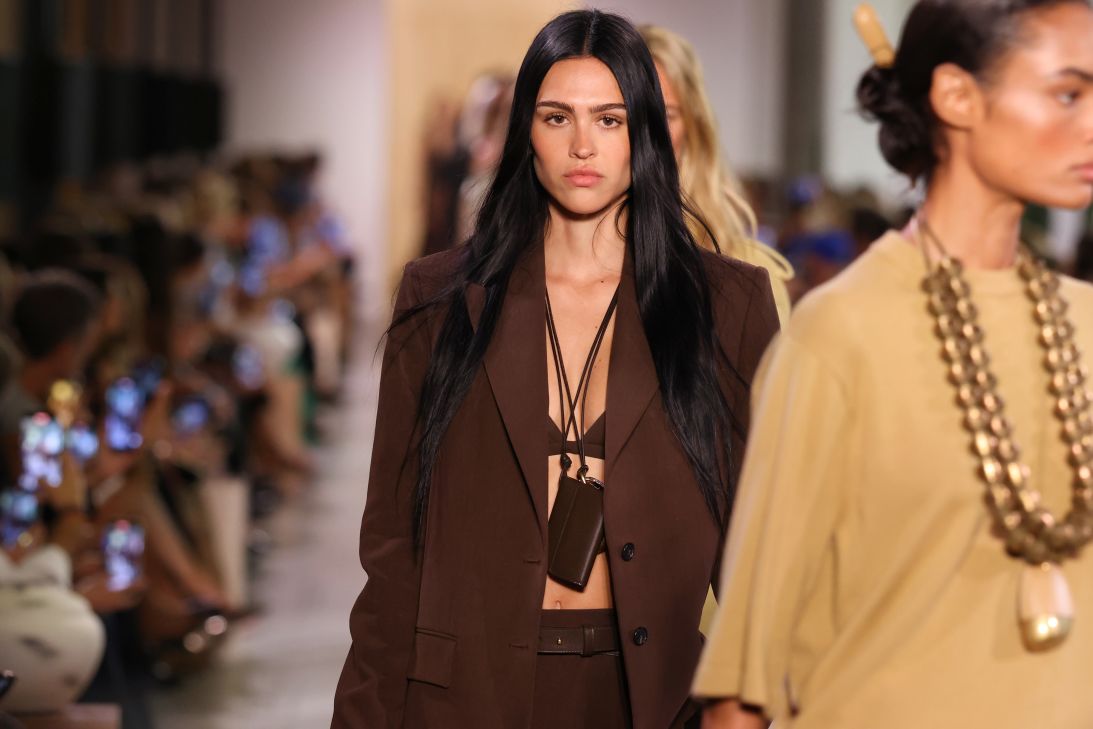 Amelia Gray walking for Michael Kors, who sent out earthy toned suits.