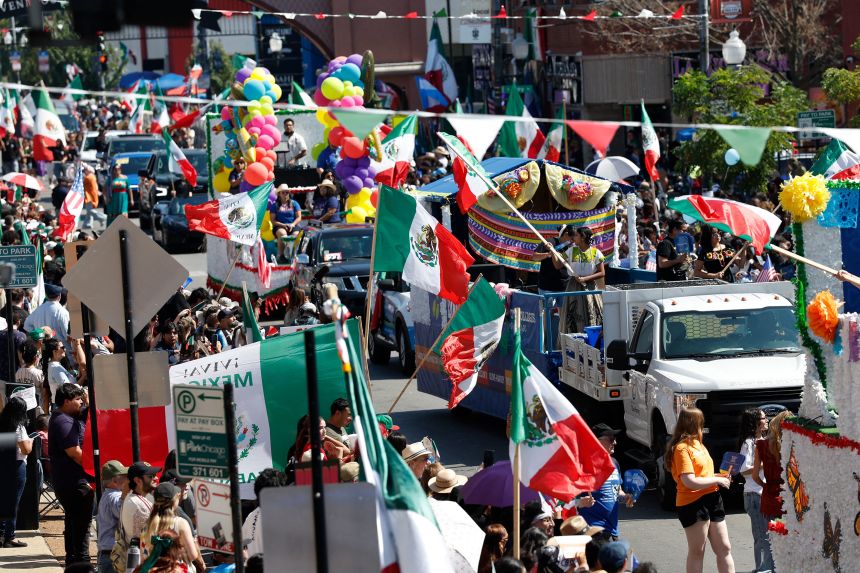 People participate in a parade for Mexico's Independence Day, themed