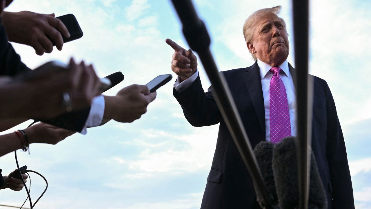 President Donald Trump speaks to members of the press before boarding Air Force One in Morristown, New Jersey on Sunday.