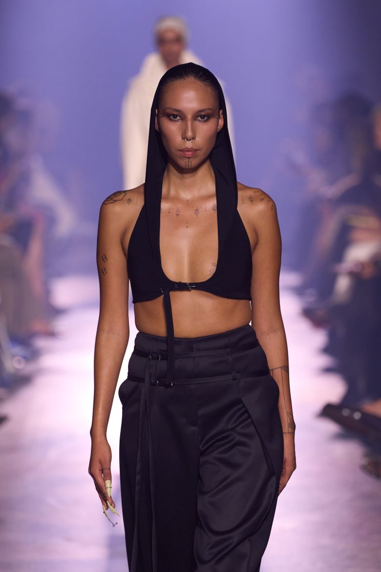 Quannah Chasinghorse in a hooded bra for Grace Ling.