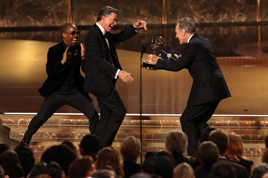 Stephen Colbert accepts the outstanding talk series award for 