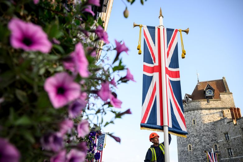 A banner being installed in a street outside Windsor Castle ahead of President Trump's official state visit.