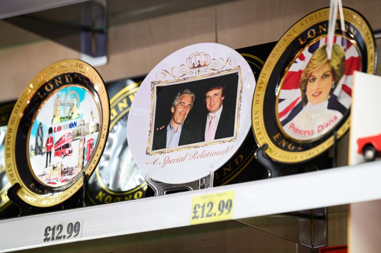 A satirical commemorative plate, featuring Trump with convicted sex trafficker Jeffrey Epstein, is seen among souvenirs after being placed in a Windsor gift shop by a protest group.