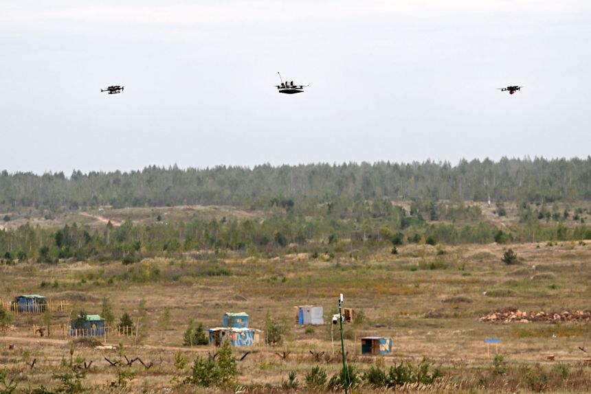 Drones fly during the
