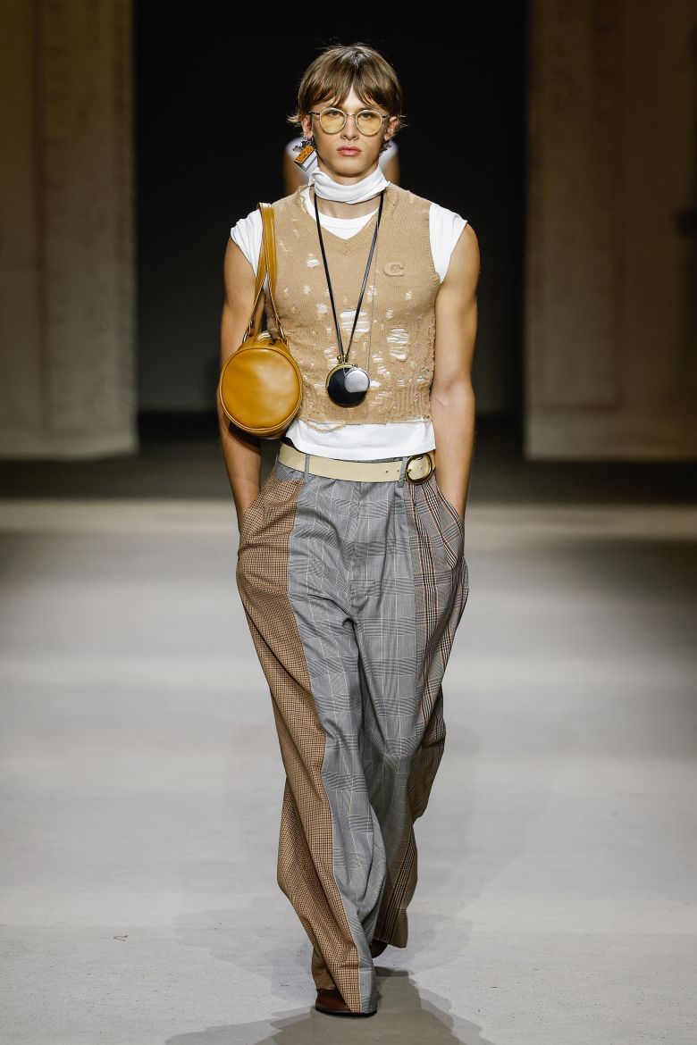 Distressed knitwear and multi-colored textiles in tans and greys reflected the patina of city structures over time.
