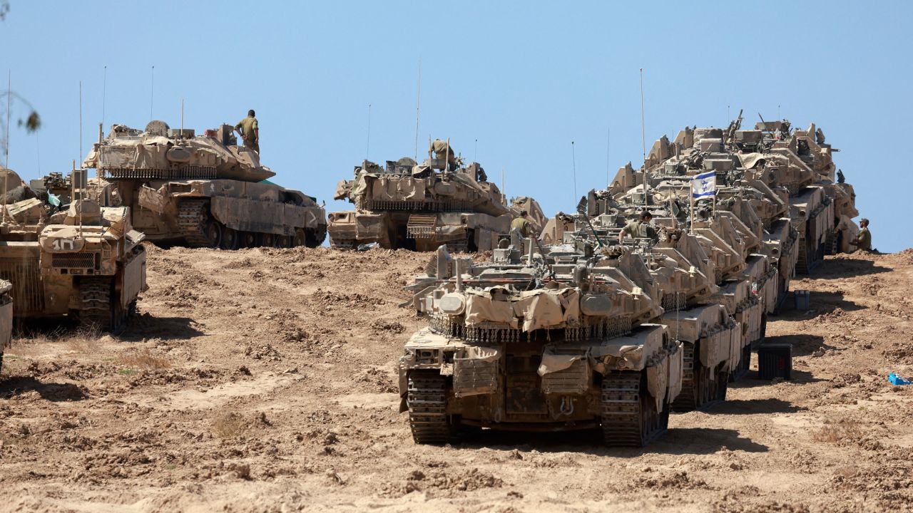 A convoy of Israeli tanks is deployed at Israel's border with the Gaza Strip on September 16, 2025. Israel launched its ground assault on Gaza City before dawn on September 16, shortly after US Secretary of State Marco Rubio's visit expressing robust support for the offensive, while a United Nations probe charged Israel with committing "genocide" in the Palestinian territory and accused its Prime Minister and other top officials of incitement. (Photo by Menahem KAHANA / AFP) (Photo by MENAHEM KAHANA/AFP via Getty Images)          