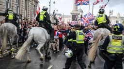 LONDON, ENGLAND - SEPTEMBER 13: Police contain supporters of Tommy Robinson at the top end of Whitehall during the "Unite The Kingdom" rally on September 13, 2025 in London, England. Far-right activist Tommy Robinson (also known as Stephen Yaxley-Lennon) has invited supporters to hold a rally in central London entitled "Unite The Kingdom". The former English Defence League leader  and his supporters are actively islamaphobic and racist and have been behind much of the unrest seen outside hotels housing migrants this summer. Stand Up To Racism are mounting a counter-protest to today's rally. (Photo by Guy Smallman/Getty Images)