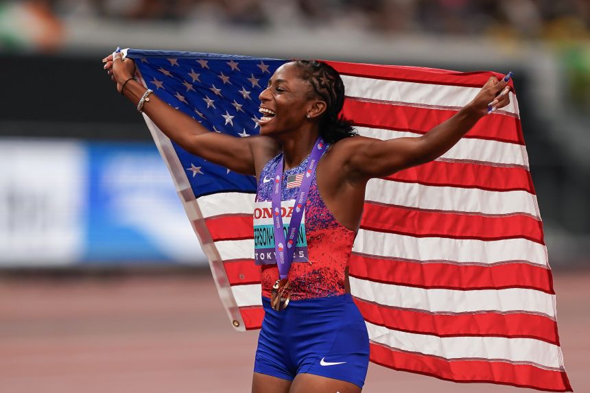 Melissa Jefferson-Wooden celebrates winning her world title.