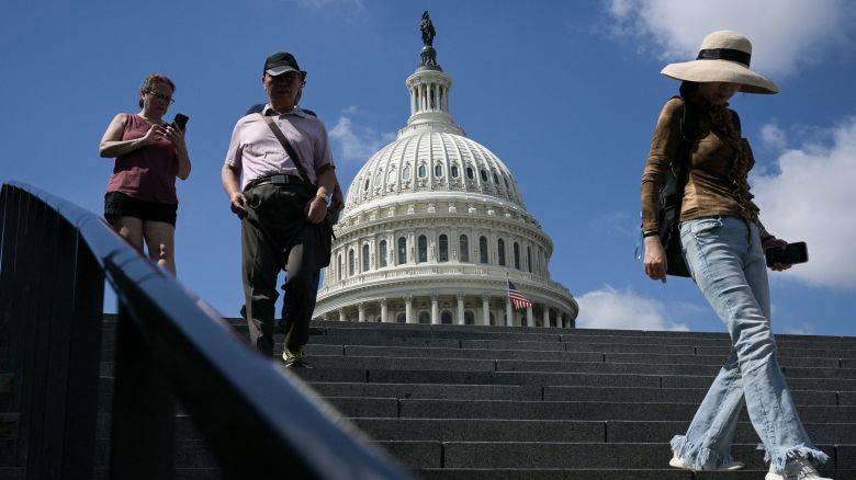 Visitors walk down stairs outside the US Capitol in Washington, DC, on September 18, 2025. (Photo by Oliver Contreras / AFP) (Photo by OLIVER CONTRERAS/AFP via Getty Images)          
