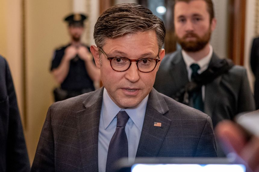 House Speaker Mike Johnson departs from the House Chamber on Friday.