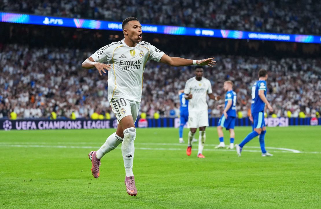 Mbappé celebrates one of his two goals in Real Madrid's debut in this Champions League.