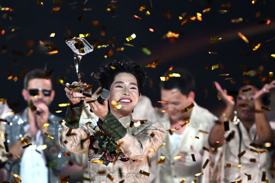 Vietnam's Duc Phuc lifts the trophy as he celebrates winning the "Intervision" song contest in Moscow on Sunday.