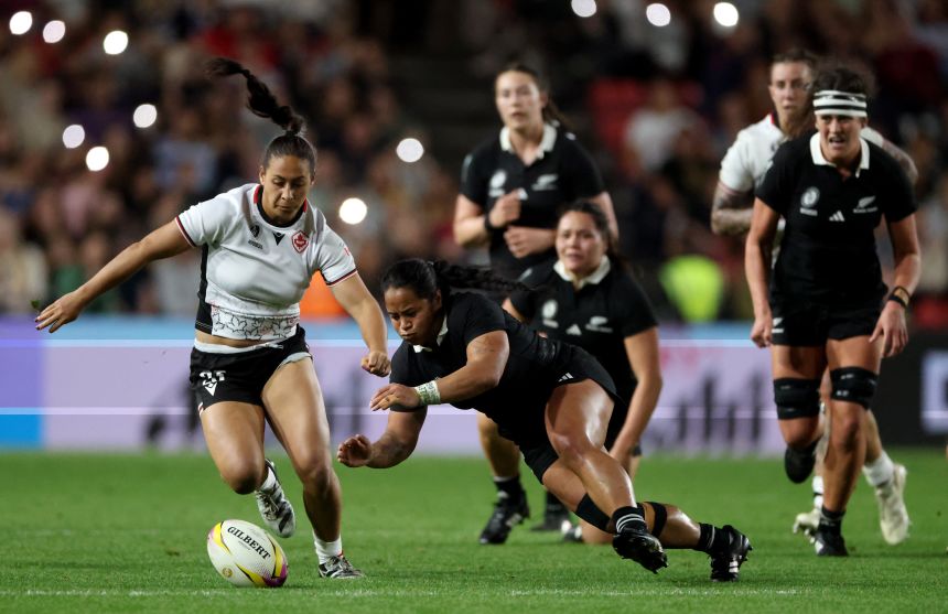 New Zealand's Ayesha Leti-I'iga attempts to gather the loose ball while under pressure from Canada's Shoshanah Seumanutafa.