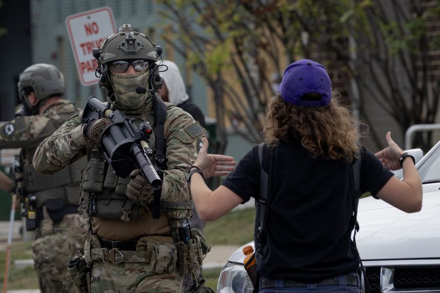 Federal law enforcement agents confront protesters at the ICE facility in Broadview, Illinois, on September 19.