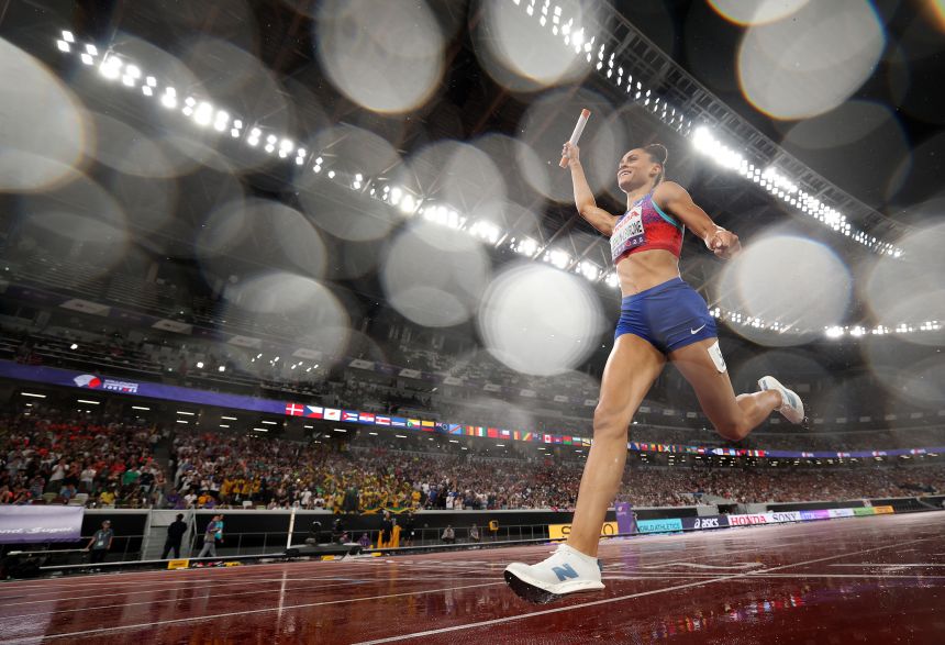 Sydney McLaughlin-Levrone celebrates as she crosses the finish line to win the gold medal in the women's 4x400m relay final.