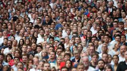 Attendees watch the memorial service for conservative activist Charlie Kirk at State Farm Stadium in Glendale, Arizona, on September 21.